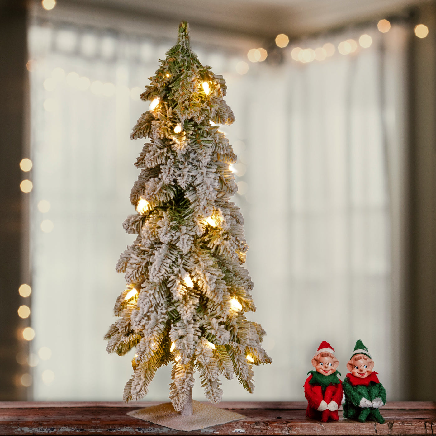 2 ft. Pre-Lit Snowy Downswept Forest Tree with Clear Lights