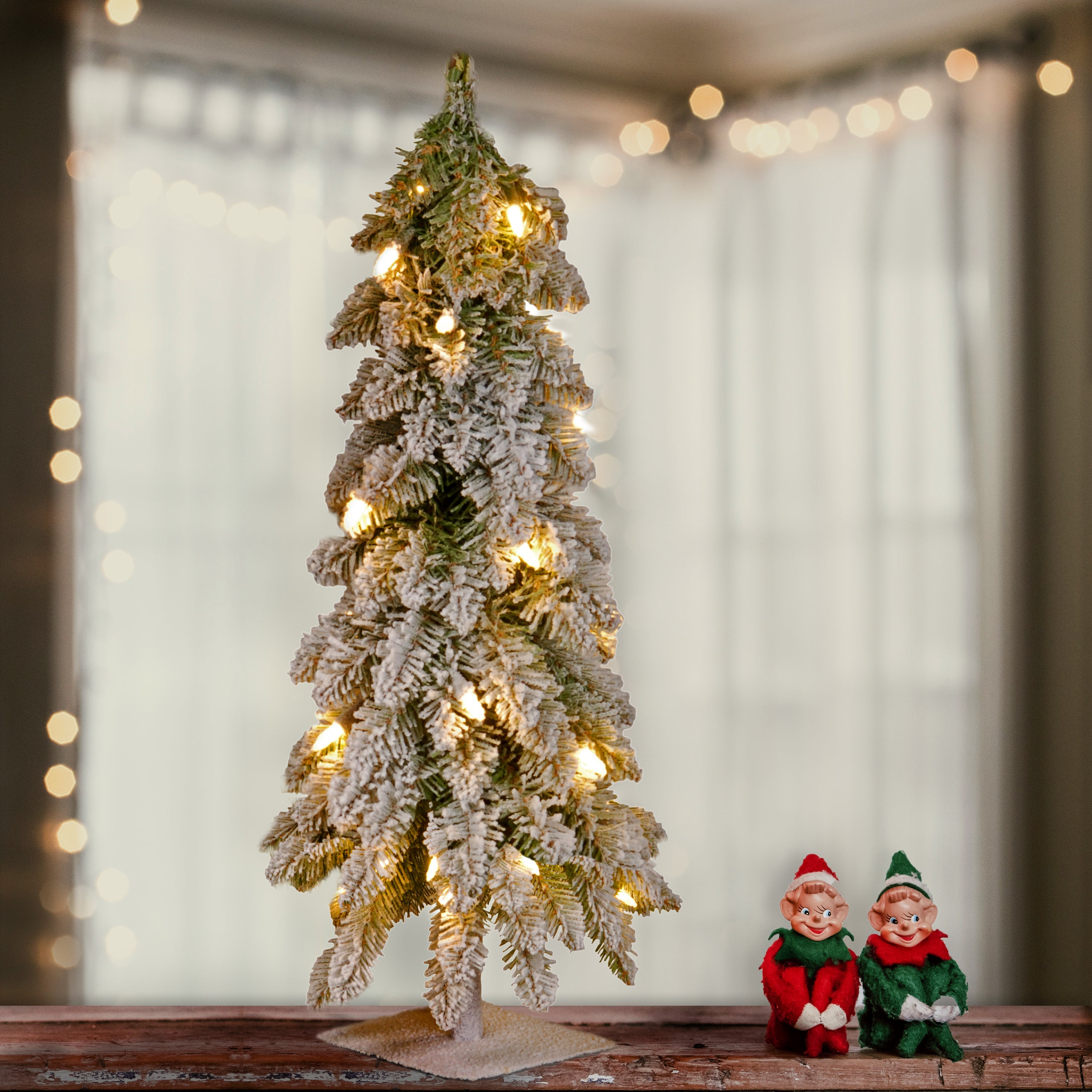 2 ft. Pre-Lit Snowy Downswept Forest Tree with Clear Lights