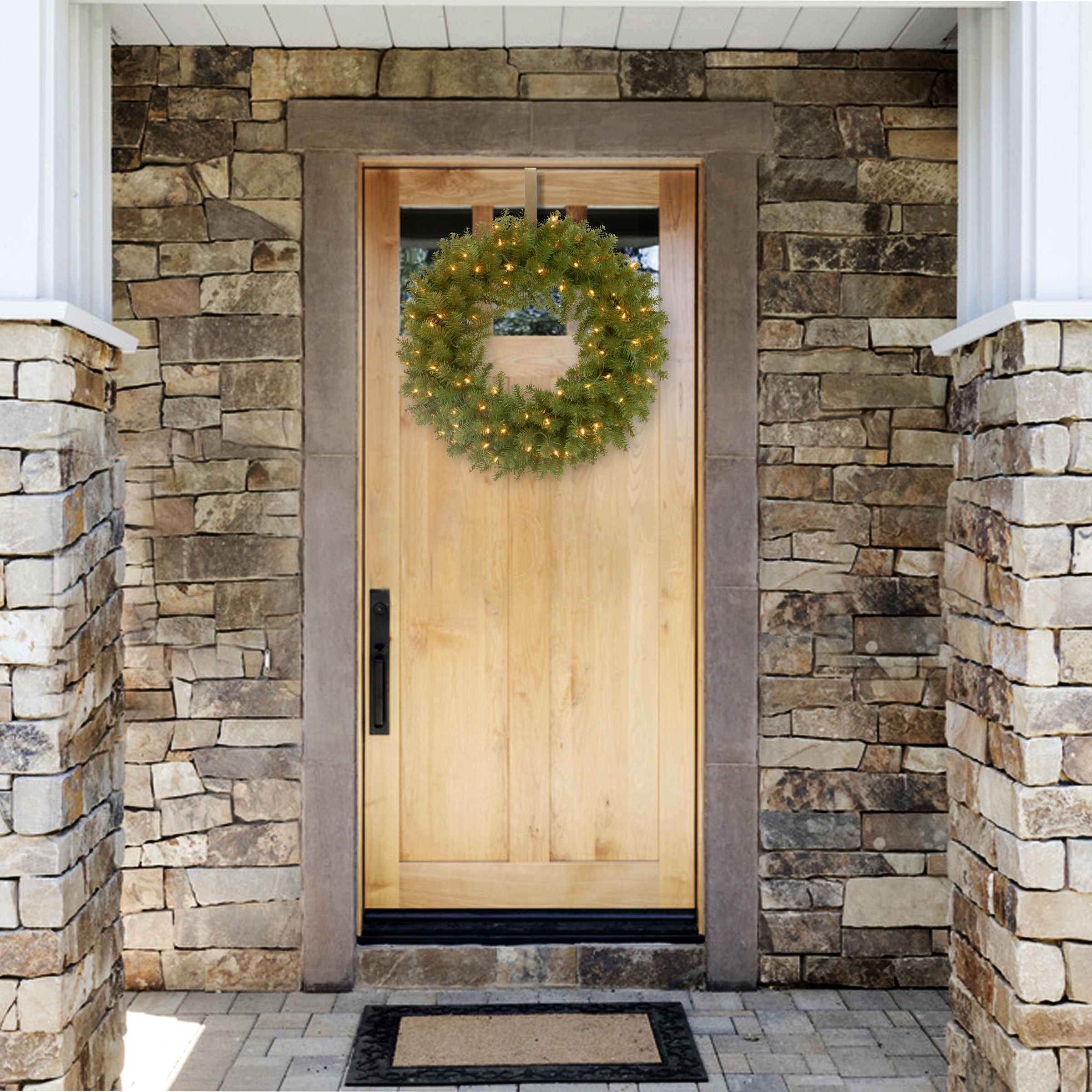 24 in. Pre-Lit North Valley Spruce Wreath with Clear Lights